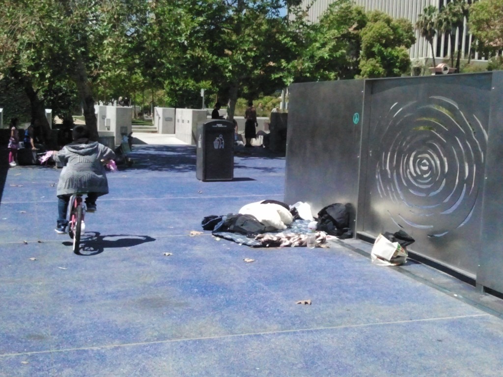 A homeless man sleeping behind the memorial shows we still have a long way to go to live up to RFK's ideals.